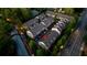 Birds-eye-view of a residential townhome neighborhood with lush trees and street access at 3663 Brookhaven Manor Ne Xing, Atlanta, GA 30319