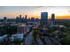 Aerial view of townhomes in a vibrant city setting at sunset at 3663 Brookhaven Manor Ne Xing, Atlanta, GA 30319