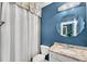 Stylish bathroom featuring a granite countertop, decorative mirror, and shower with curtain at 3663 Brookhaven Manor Ne Xing, Atlanta, GA 30319