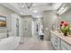 Luxurious bathroom features a standalone tub, glass shower, and vanity with a chandelier at 3663 Brookhaven Manor Ne Xing, Atlanta, GA 30319