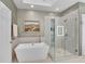 Bright bathroom featuring a modern tub, glass shower, and stylish fixtures at 3663 Brookhaven Manor Ne Xing, Atlanta, GA 30319