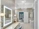 Bright bathroom with a dressing table, glass shower, chandelier, and modern fixtures at 3663 Brookhaven Manor Ne Xing, Atlanta, GA 30319
