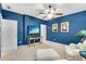 Bedroom with comfortable seating, a flat-screen TV, and light beige carpet at 3663 Brookhaven Manor Ne Xing, Atlanta, GA 30319