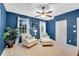 Bright bedroom featuring cozy seating area, ceiling fan, and neutral carpet at 3663 Brookhaven Manor Ne Xing, Atlanta, GA 30319