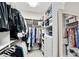 This walk-in closet has plenty of storage with shelves, drawers, and hanging racks at 3663 Brookhaven Manor Ne Xing, Atlanta, GA 30319