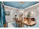 Formal dining room showcasing blue ceiling, intricate chandelier, hardwood floors, and elegant decor at 3663 Brookhaven Manor Ne Xing, Atlanta, GA 30319