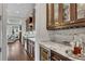 Elegant kitchen featuring sleek granite countertops, wine storage, and seamless access to the living room at 3663 Brookhaven Manor Ne Xing, Atlanta, GA 30319