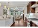 Modern kitchen featuring granite countertops and stainless steel appliances, seamlessly connected to a cozy living room at 3663 Brookhaven Manor Ne Xing, Atlanta, GA 30319