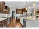 Bright kitchen featuring custom wood cabinets, stainless steel appliances, and a granite island at 3663 Brookhaven Manor Ne Xing, Atlanta, GA 30319