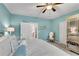 Bright main bedroom featuring light blue walls, white bedding, and neutral carpet at 3663 Brookhaven Manor Ne Xing, Atlanta, GA 30319