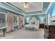 Main bedroom featuring tray ceiling, lots of light, and stylish furnishings at 3663 Brookhaven Manor Ne Xing, Atlanta, GA 30319