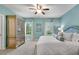 Serene main bedroom with light blue walls, white bedding, and lots of natural light at 3663 Brookhaven Manor Ne Xing, Atlanta, GA 30319