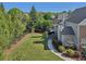 Spacious backyard features a lush lawn, privacy fence, and a cozy outdoor dining area at 403 Grassmeade Way, Snellville, GA 30078