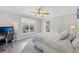 Bright bedroom with neutral walls, computer desk and chair, and ceiling fan at 403 Grassmeade Way, Snellville, GA 30078