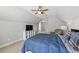 Upstairs bedroom with ceiling fan, carpet, closet, and neutral paint at 403 Grassmeade Way, Snellville, GA 30078