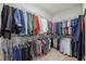 A well-organized closet with hanging racks filled with clothes, showcasing ample storage space at 403 Grassmeade Way, Snellville, GA 30078