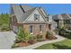Beautiful two-story brick home boasts a manicured lawn and attached two-car garage at 403 Grassmeade Way, Snellville, GA 30078