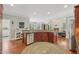 Spacious kitchen with stainless steel appliances, hardwood floors, and open layout for seamless cooking and entertaining at 403 Grassmeade Way, Snellville, GA 30078