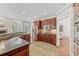 Well-equipped kitchen with hardwood floors, stainless steel appliances, and stone countertops for easy meal preparation at 403 Grassmeade Way, Snellville, GA 30078