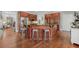 Spacious kitchen features a large island, stainless steel appliances and hardwood flooring at 403 Grassmeade Way, Snellville, GA 30078