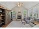Comfortable living room with fireplace, vaulted ceiling and view to the outdoors at 403 Grassmeade Way, Snellville, GA 30078
