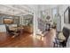 Inviting open-concept living and dining areas with hardwood floors and coffered ceilings, perfect for gatherings at 403 Grassmeade Way, Snellville, GA 30078