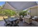 Comfortable patio with outdoor furniture, perfect for relaxing or entertaining under the sun shade at 403 Grassmeade Way, Snellville, GA 30078