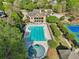 Aerial view of a large in-ground pool and the clubhouse with a second story balcony at 403 Grassmeade Way, Snellville, GA 30078