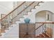 Beautiful staircase with decorative iron railing and wooden accents, adding elegance to the home's design at 403 Grassmeade Way, Snellville, GA 30078