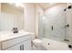 This bathroom has a glass shower and a vanity with white cabinets and black fixtures at 4202 Adler Cir, Buford, GA 30519