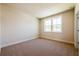 Bedroom with carpet flooring, light walls, white trim, and double window at 4202 Adler Cir, Buford, GA 30519