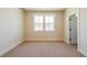 Bedroom featuring carpet flooring, light walls, white trim, and double window at 4202 Adler Cir, Buford, GA 30519