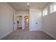 This bedroom has carpeted floors, neutral walls, white trim, and a double-door closet at 4202 Adler Cir, Buford, GA 30519