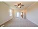 A spacious bonus room with carpeted floors, neutral walls, and a ceiling fan at 4202 Adler Cir, Buford, GA 30519