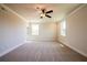 Large, open bonus room with carpeted floors, neutral walls and white trim at 4202 Adler Cir, Buford, GA 30519