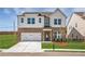 Charming two-story home featuring a brick facade, white accents, and a well-manicured front yard at 4202 Adler Cir, Buford, GA 30519