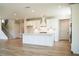 Bright, open kitchen featuring white cabinets, an island, and stainless steel appliances at 4202 Adler Cir, Buford, GA 30519