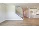 Open living space featuring modern flooring and a staircase leading to the upper level at 4202 Adler Cir, Buford, GA 30519