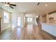 Sunlit living room featuring recessed lighting and stairs leading upstairs to bedrooms at 4202 Adler Cir, Buford, GA 30519