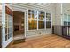 Exterior wooden deck view with a view of the house and trees at 11302 Musette Cir, Alpharetta, GA 30009
