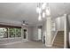 Bright living area with fireplace, windows, and balcony access, perfect for relaxing at 11302 Musette Cir, Alpharetta, GA 30009