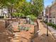 A charming neighborhood playground is surrounded by townhomes and mature trees, offering a secure play space at 11302 Musette Cir, Alpharetta, GA 30009