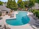 An inviting community pool features ample lounge space, perfect for relaxation and socializing near residential area at 11302 Musette Cir, Alpharetta, GA 30009
