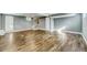Spacious finished basement with light gray walls and hardwood floors, ready for customization at 1441 Cahaba Sw Dr, Atlanta, GA 30311