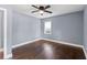 Bedroom with hardwood floors, a ceiling fan, and a window at 1441 Cahaba Sw Dr, Atlanta, GA 30311