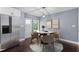 Bright dining room featuring a marble table, modern chairs, and a stainless steel refrigerator at 1441 Cahaba Sw Dr, Atlanta, GA 30311