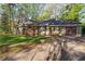 Charming single-story home with a inviting front porch and an attached garage at 1441 Cahaba Sw Dr, Atlanta, GA 30311