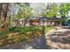 A cozy, one-story house with a welcoming porch and a well-maintained lawn at 1441 Cahaba Sw Dr, Atlanta, GA 30311