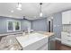 Modern kitchen featuring granite countertops, a farmhouse sink, and stainless steel appliances at 1441 Cahaba Sw Dr, Atlanta, GA 30311