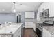 Modern kitchen featuring stainless steel appliances, stone counters, and subway backsplash at 1441 Cahaba Sw Dr, Atlanta, GA 30311